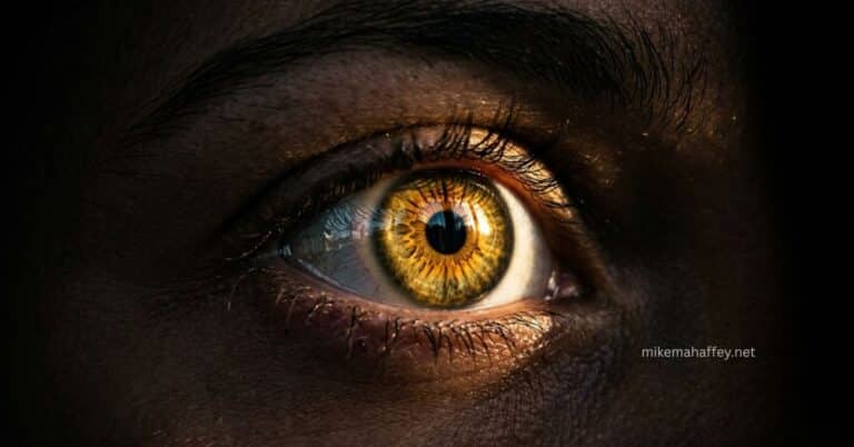 An extreme close-up of a single human eye with a luminous golden iris glowing against dark surrounding skin, illustrating the biblical concept of spiritual eyesight and seeing with the light of God.