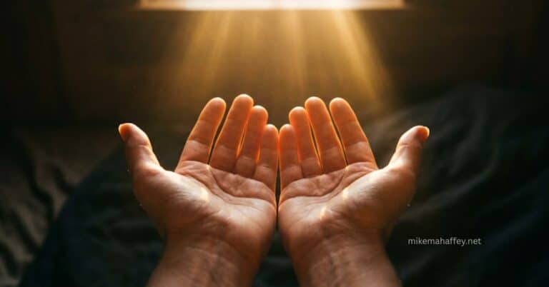 Two open hands raised upward with rays of golden light streaming down from above, illustrating the posture of faith receiving from God through love.