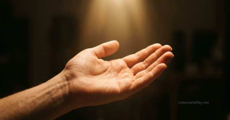 An open hand receiving golden light from above, representing Christ's righteousness credited to the believer through faith.