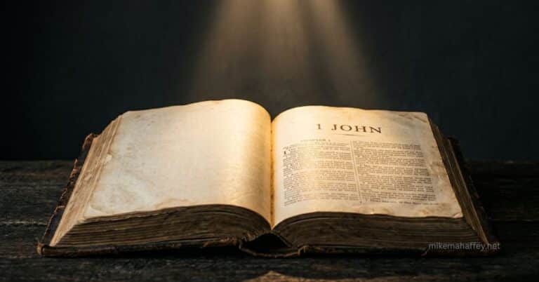 Open Bible illuminated by a shaft of light, illustrating the meaning of confession and the blood of Jesus in 1 John 1:9.